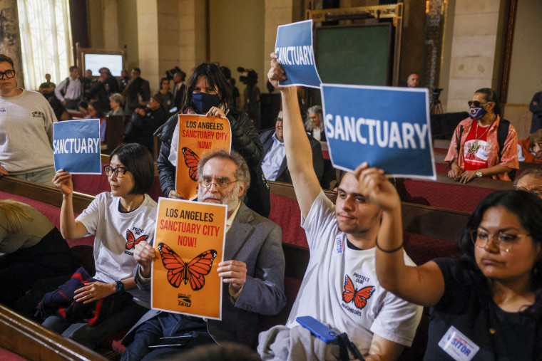 Activists with signs.