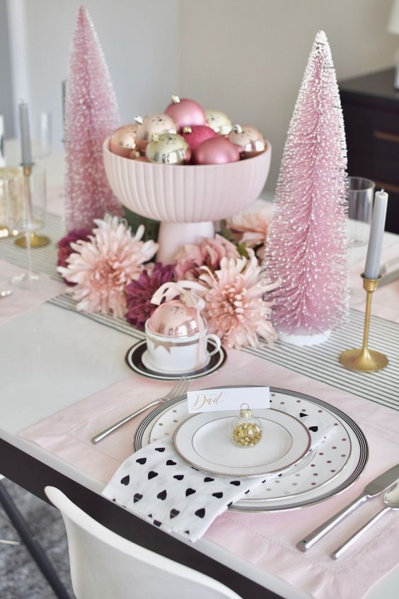 Christmas centerpiece with two pastel-colored trees.