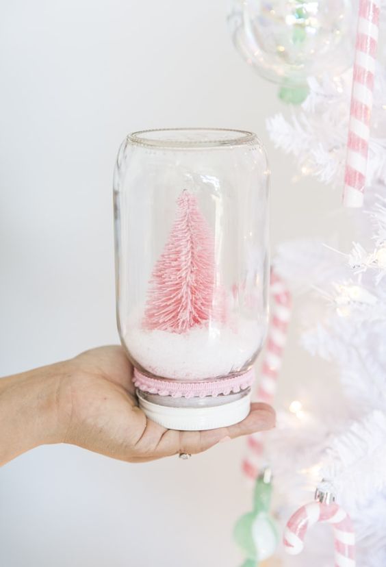 Pastel pink tree in recycled glass jar.