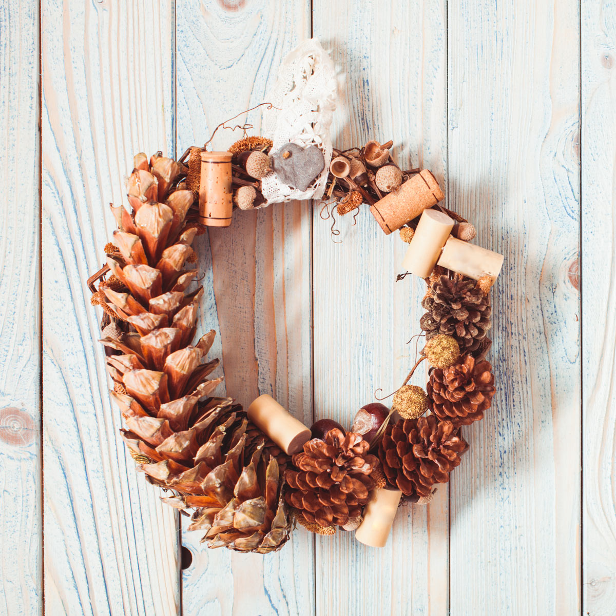 Shabby Christmas wreath with natural pine cones.