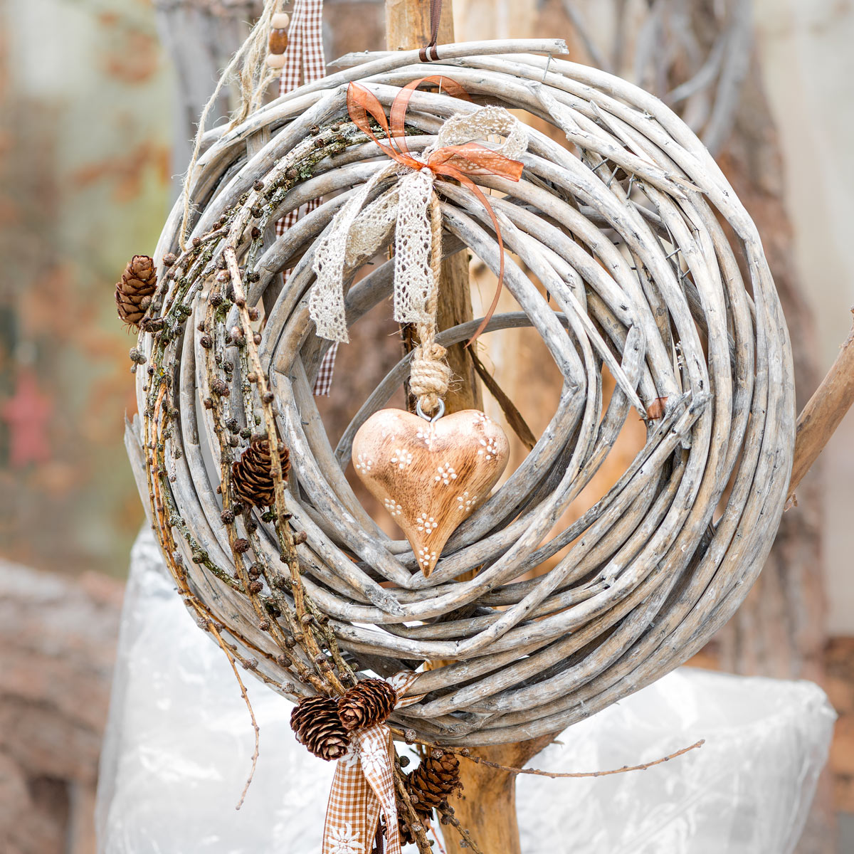 shabby wreath decorated with pine cones