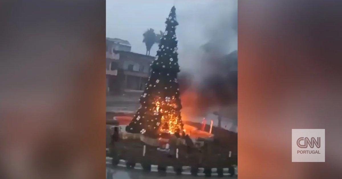 Christians protest in the Syrian capital after the burning of a Christmas tree