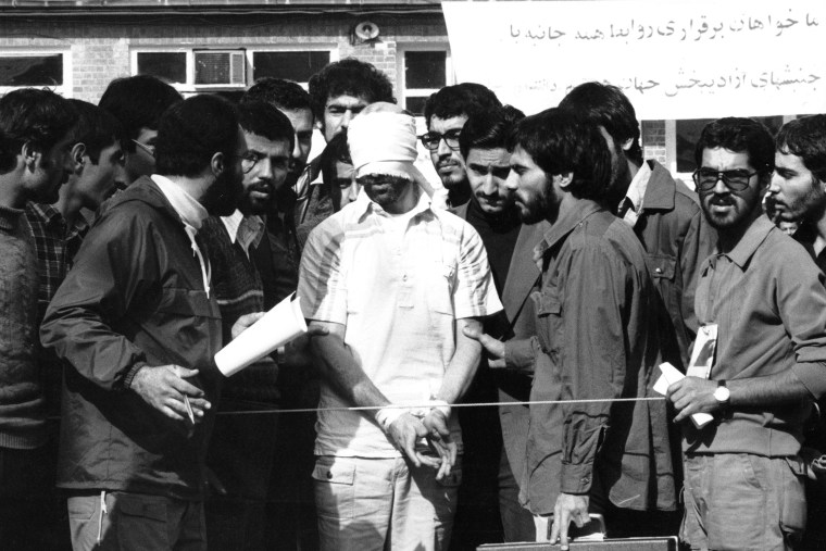 Students with an American hostage at the U.S. embassy in Tehran, Iran, on Nov. 11, 1979.