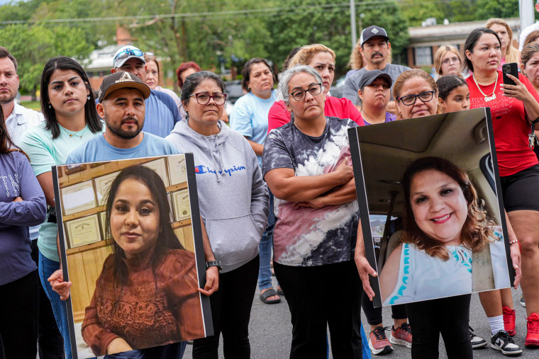 Erwin citizens with pictures of their missing loved ones.