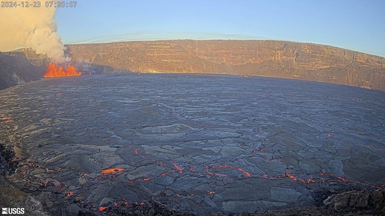 In this aerial photo provided by the U.S. Geological Survey, an eruption takes place on the summit of the Kilauea volcano in Hawaii, Monday, Dec. 23, 2024. 