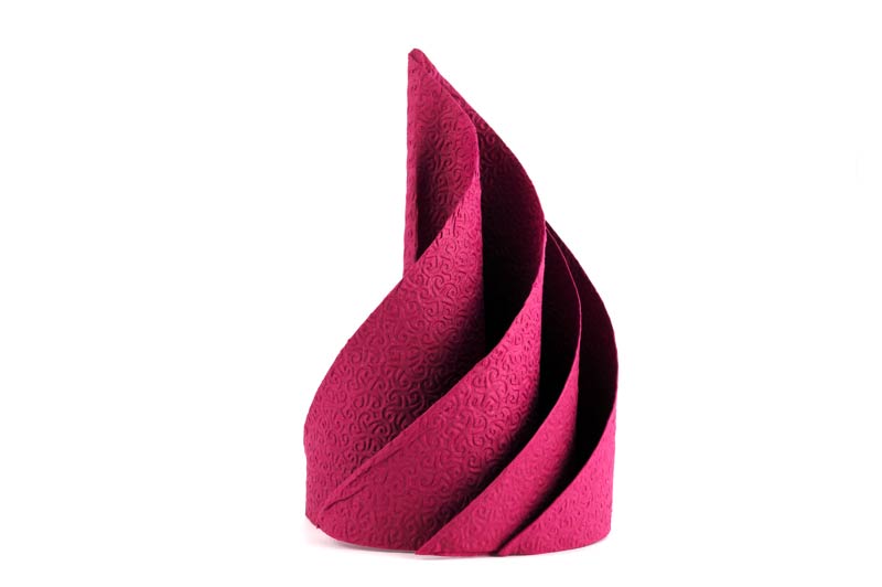 An original way to fold a paper napkin to embellish the table.
