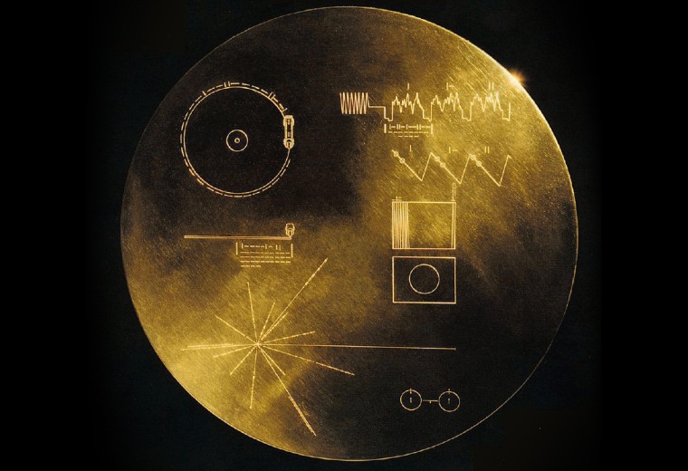 The "Golden Record" carried by Voyager was a 12-inch gold-plated copper disk containing sounds and images selected to portray the diversity of life and culture on Earth.