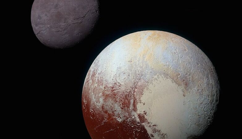 Pluto and Charon united with a kiss (and a capture)