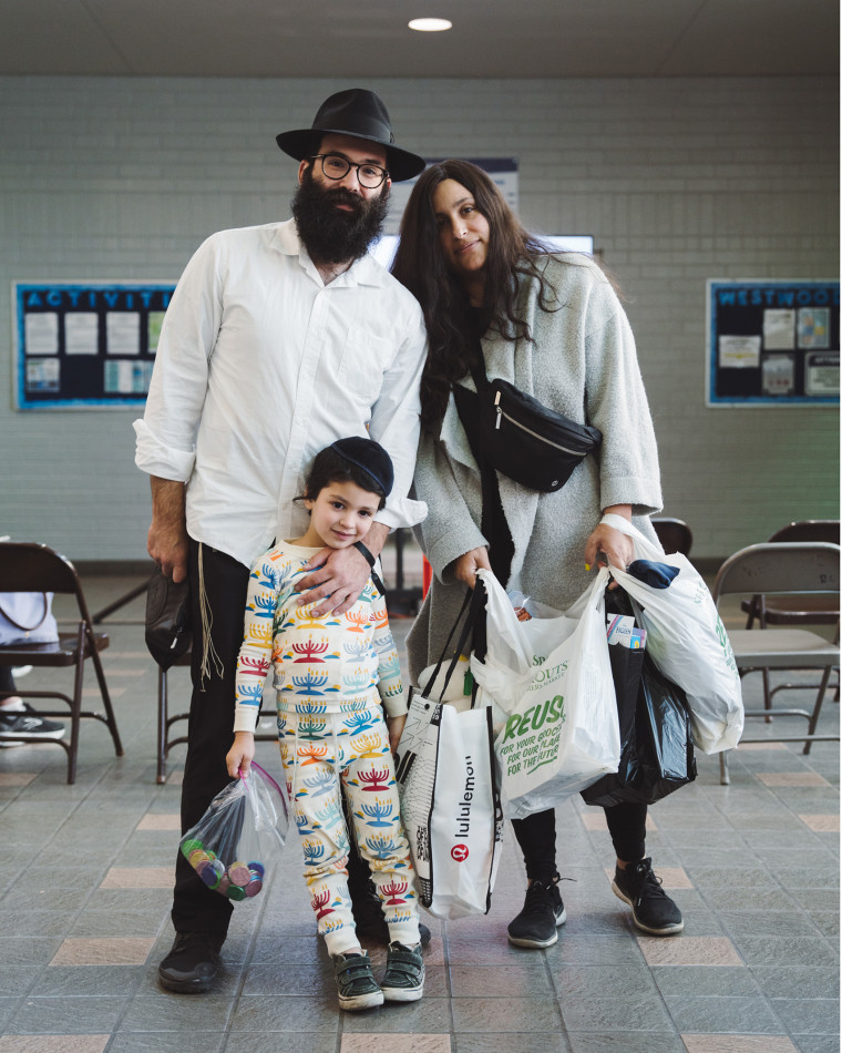 Jay Gutovich donates supplies with his family at the emergency shelter at Westwood Recreation Center 