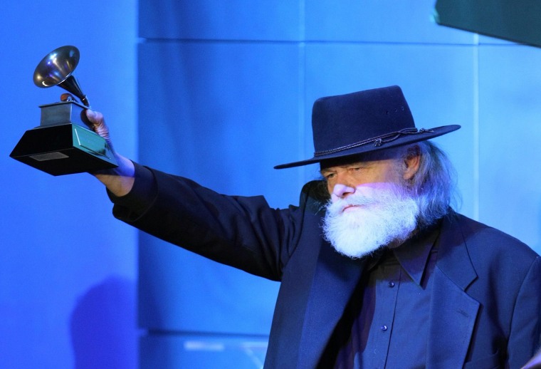 Garth Hudson accepts a lifetime achievement award from the Recording Academy in 2008.