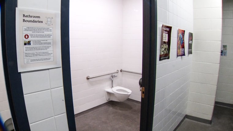 A bathroom inside of a school hallway