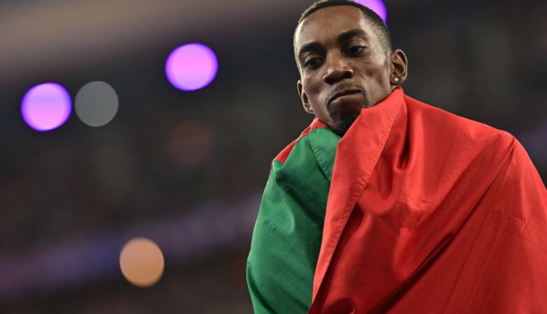 Pedro Pichardo wrapped in the Portuguese flag