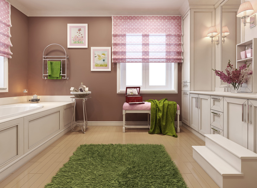 Modern bathroom with pink packet curtains with polka dot.