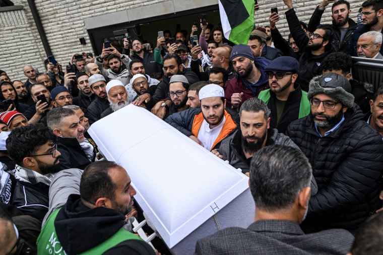 Oday Al-Fayoumi (bottom right of casket) holds the casket with the remains of his 6-year-old Palestinian American son Wadea Al-Fayoumi after a prayer service in Bridgeview, Ill. on Oct. 16, 2023. Wadea Al-Fayoumi and his mother Hanaan Shahin were stabbed several times by their landlord Joseph Cuba as he yelled anti-Muslim statements at their home in Plainfield, Illinois.