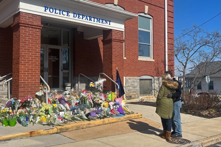 Nancy Duarte Matarese visits the memorial outside of the West York Borough Police Department Sunday afternoon with her husband.