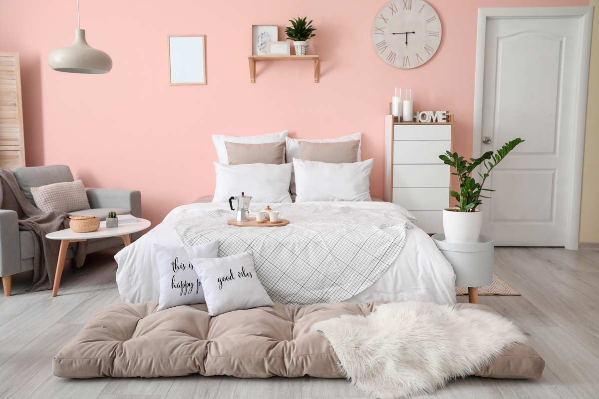 Beautiful bedroom with powder pink wall.