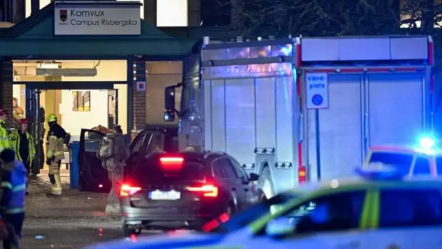 Vehicles and police in a place where an attack occurred in Sweden