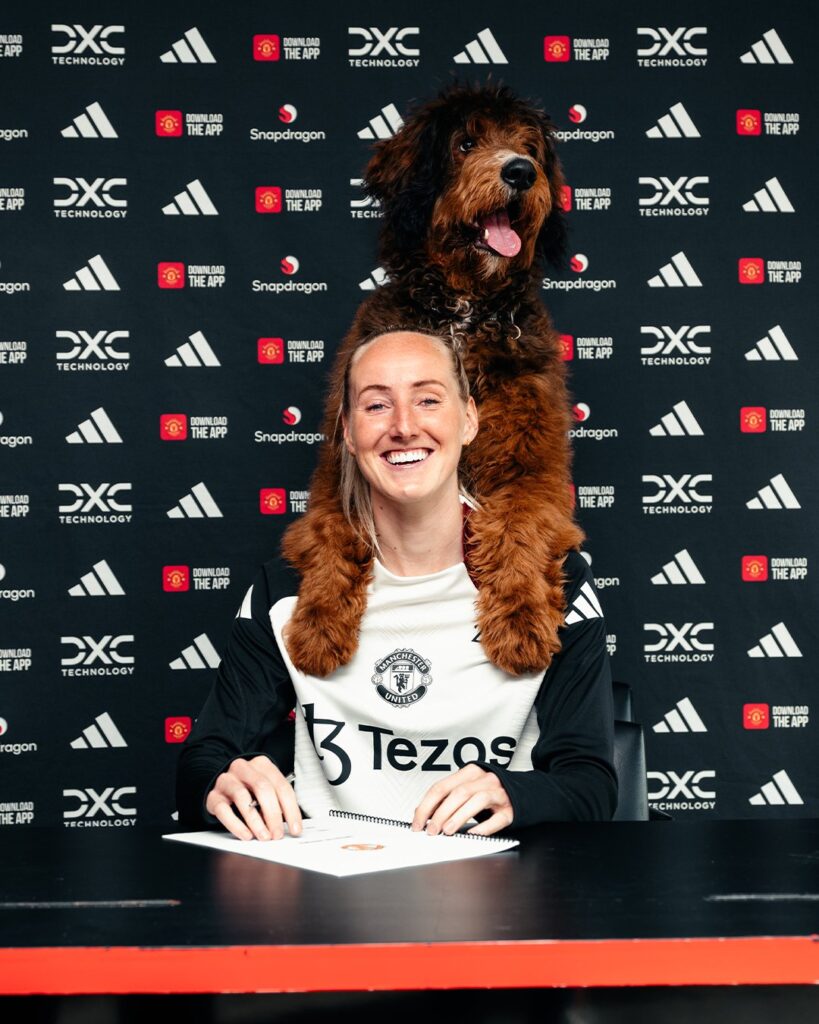 Dog steals the scene during contract renewal at Manchester United