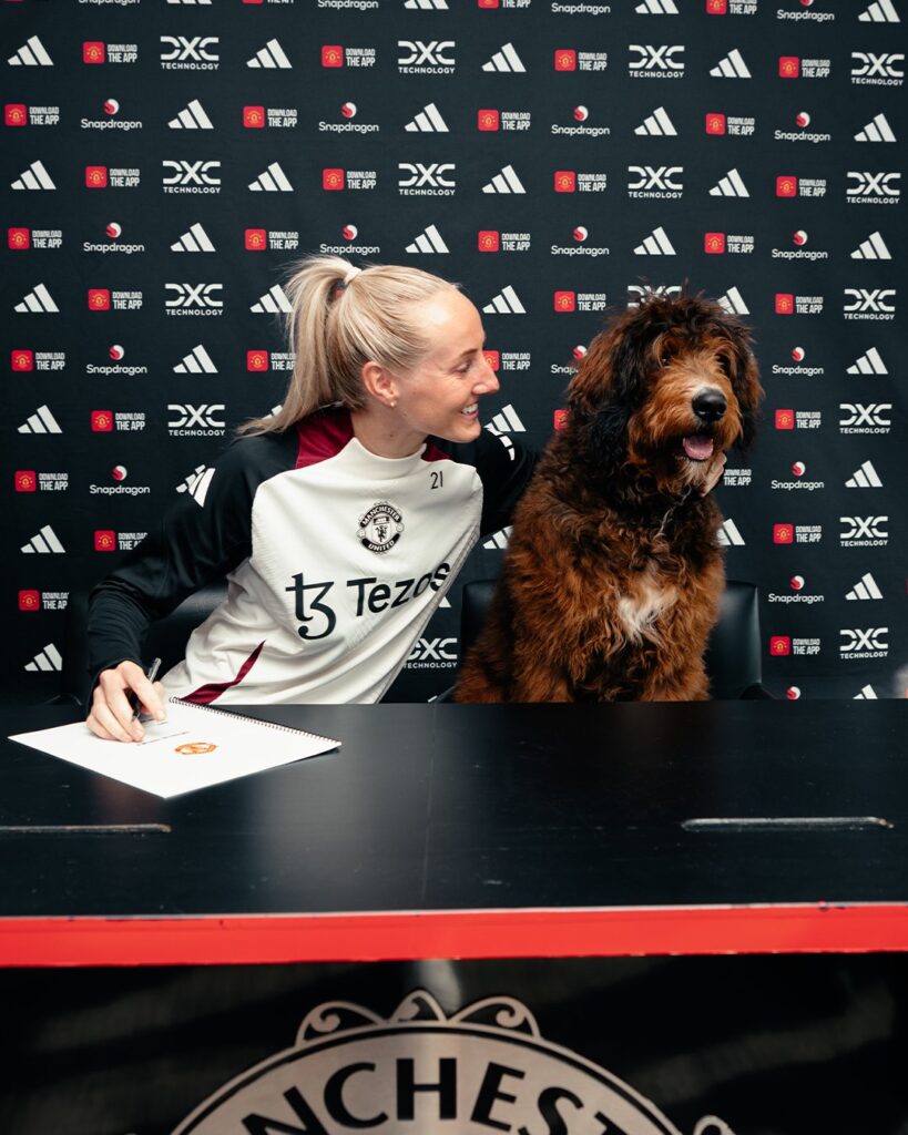 Dog steals the scene during contract renewal at Manchester United