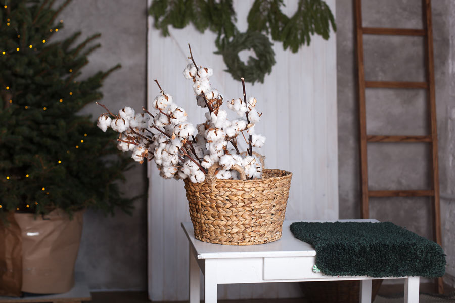 Wicker jar decorated with seedlings, ideal in a shabby style.