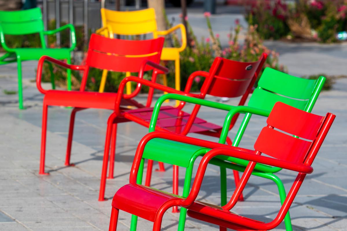 Retrieve the ruined metal chairs