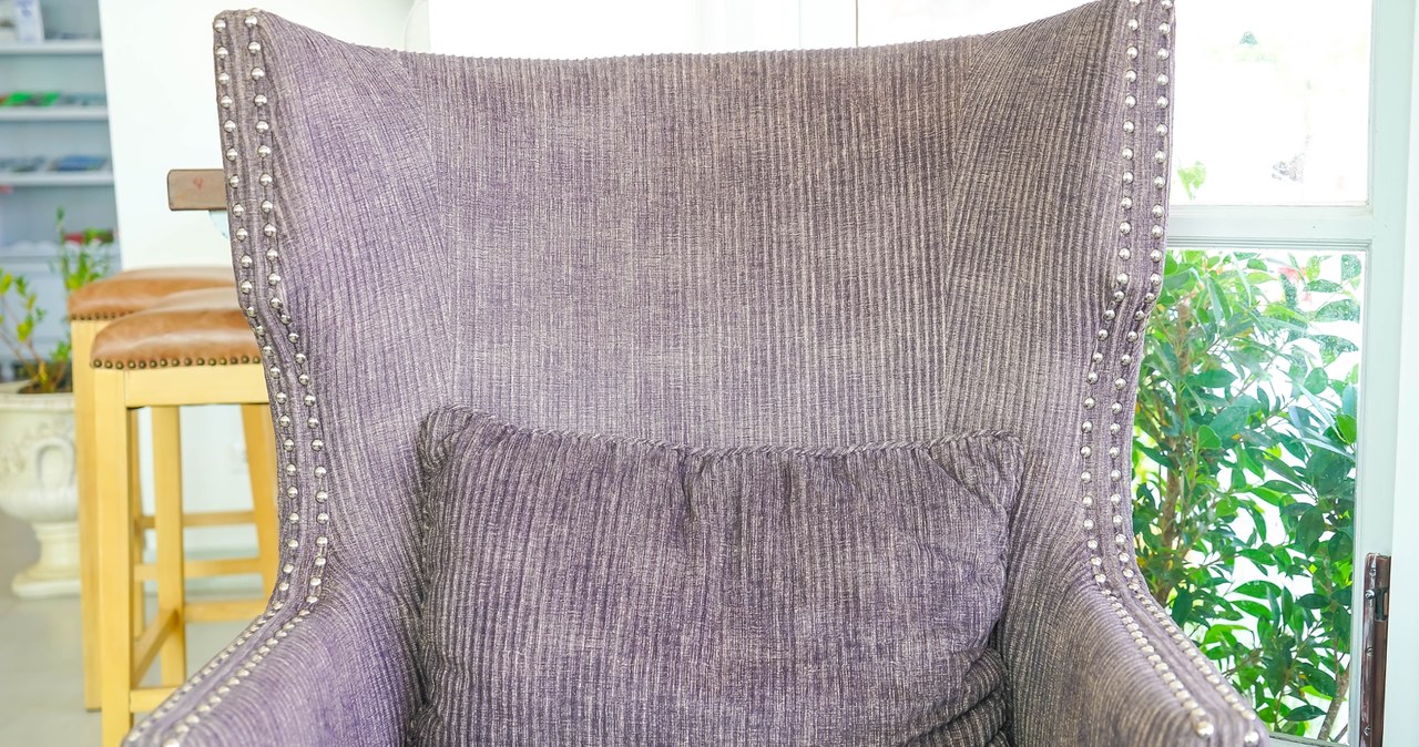 The corduroy armchair is a designer accent in the living room. /Pixel