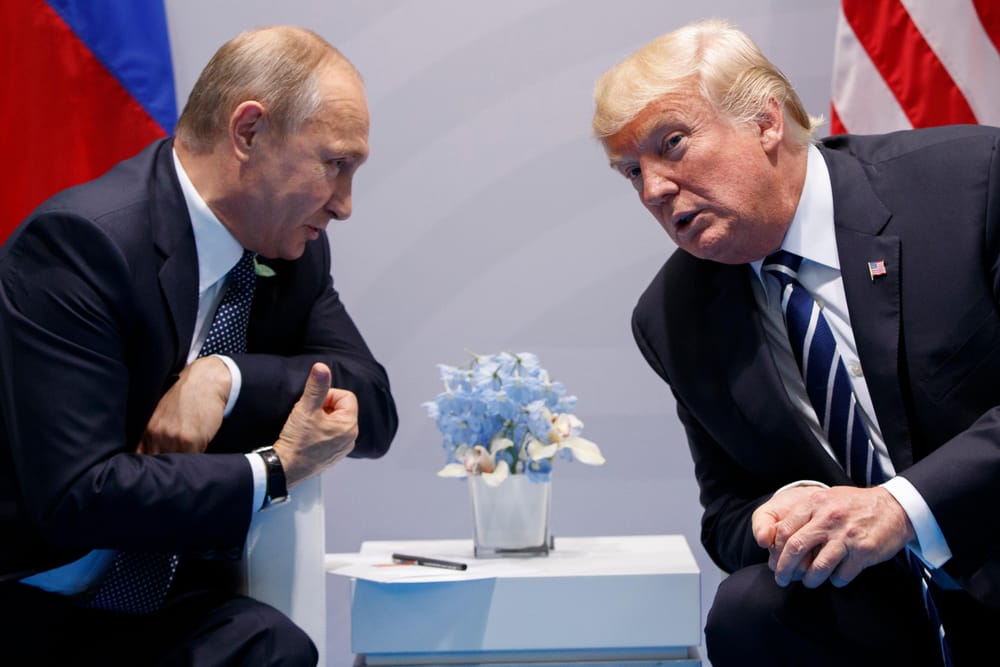 Vladimir Putin and Donald Trump at his first meeting in Hamburg in 2017 (Evan Vucci/AP)