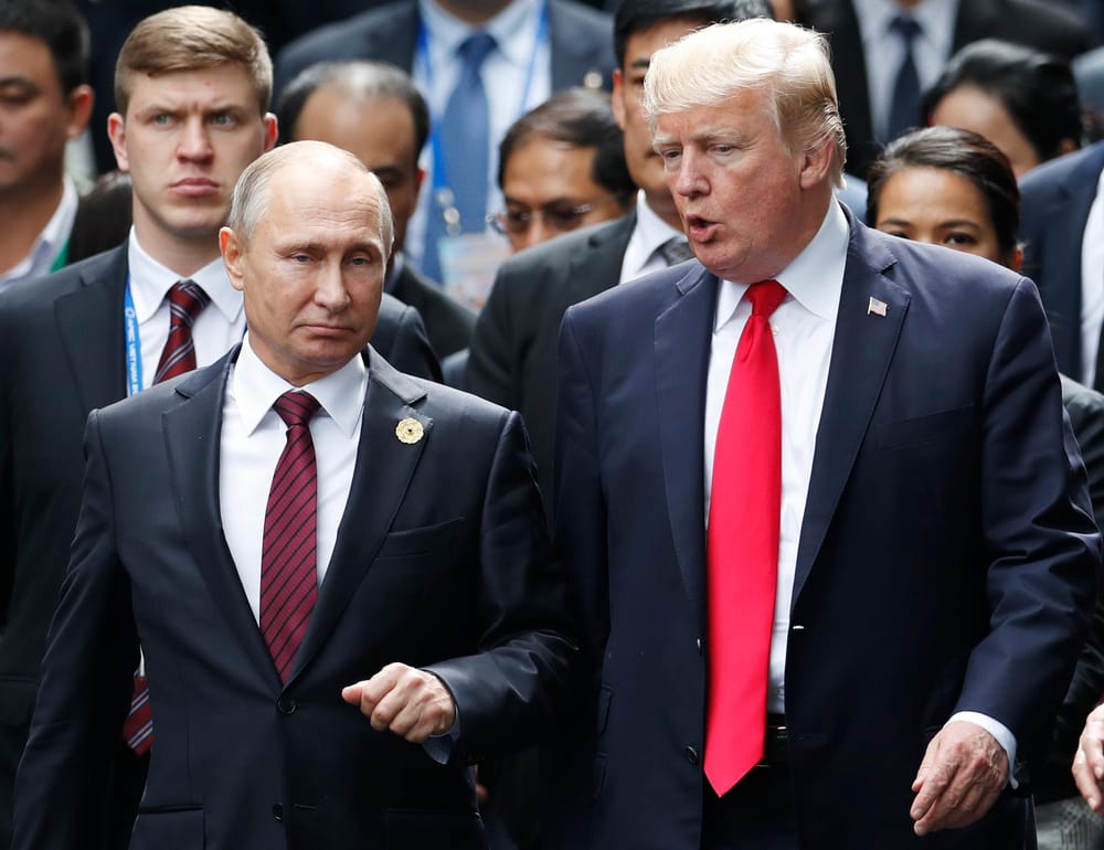 Vladimir Putin and Donald Trump lead a group of leaders at the Asia-Pacific summit that took place in 2017 at Vietname (Jorge Silva/AP)