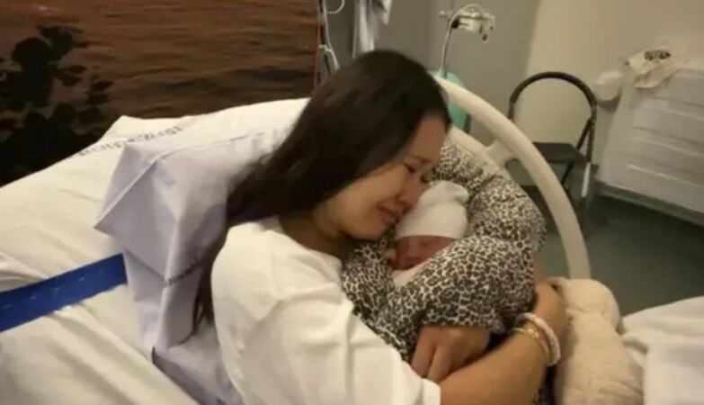 Baby removed by trauma suffered by the mother. Had been born an hour ago