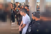 He was escorted by dozens of police officers