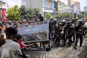 Police intervene while young Nepalese conduct a protest against the government in Catmandu, Nepal, on September 8, 2025