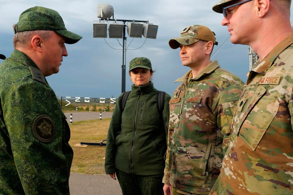 Belarus Minister of Defense Viktor Khrenin on the left speaks to Lieutenant Colonel Bryan Shoupe, according to the right, Defense at the US Embassy in Minsk, after Russian-Bielarusos Military Exercises in a training camp near Boysaw, Belarus, on Monday (Olesya (Olesya KURPYAYEVA/AFP/GETTY IMAGES via CNN Newsource)
