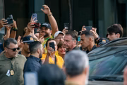 Bolsonaro supporters act in front of the hospital where he performs procedure 