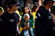 Bolsonaro supporters act in front of the hospital where he performs procedure 