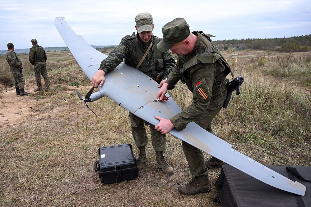 Belarusian military personnel work on an unmanned aerial vehicle (UAV) during the Russian-Belorrussian sets “Zapad-2025” (West-2025) in a training camp near the city of Borisov, east of the capital Minsk, on September 15 (Olesya Kurpyayeva/AFP/Getty Images via CNN News.