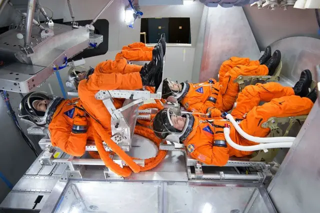A view of the arrangement of the crew seats - two seats above two seats - using a vehicle model in the Johnson space center.