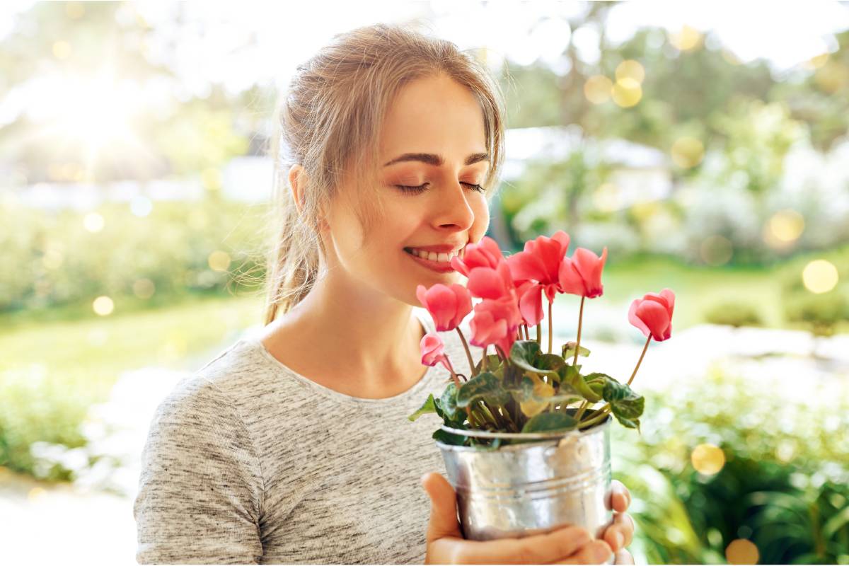 Woman with pink cyclamen
