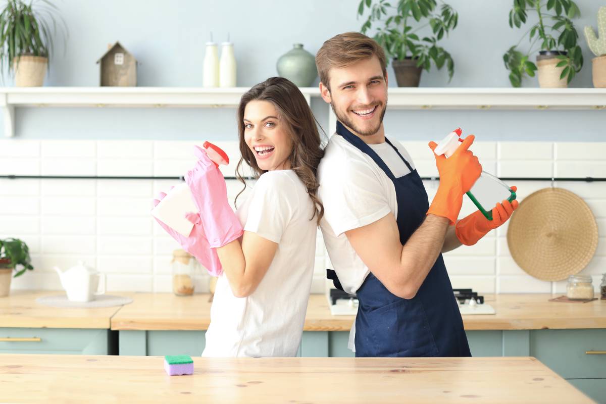 Couple cleaning the house