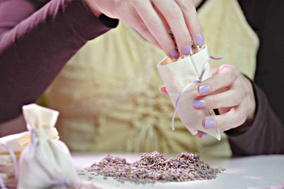 Woman making a scented bag with lavender