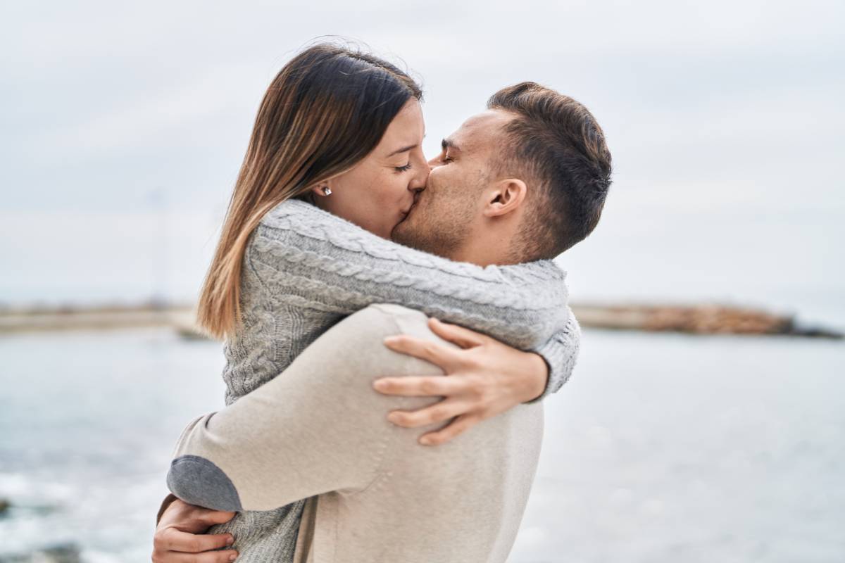 Couple kissing at the seaside