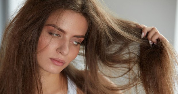 Is your hair frizzy and electrified? Spray this on your hat and you'll forget about the problem