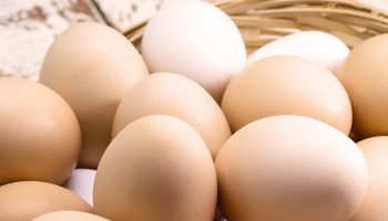 Neither in the box nor in the refrigerator door. Only eggs stored this way will remain fresh