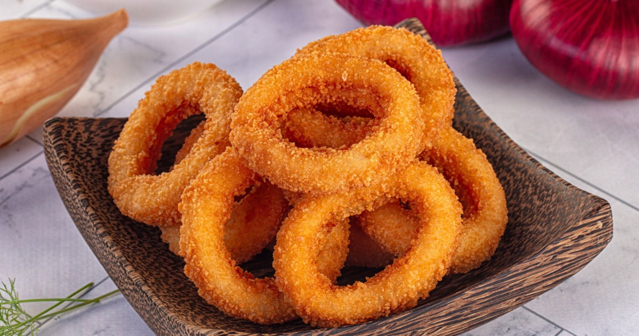A tasty snack for a party table. Crispy onion rings from the oven