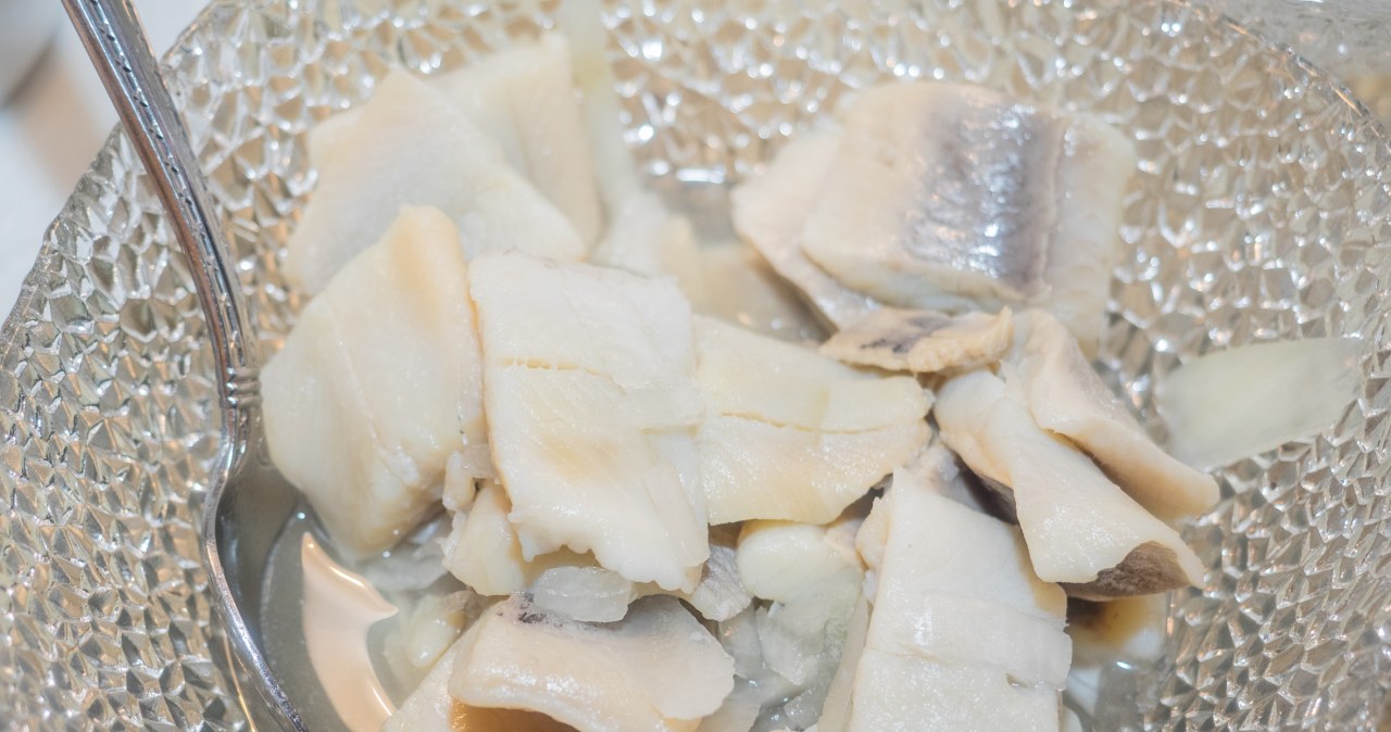 Neither in milk nor in plain water. My grandmother used to soak herrings like this, they had the perfect taste