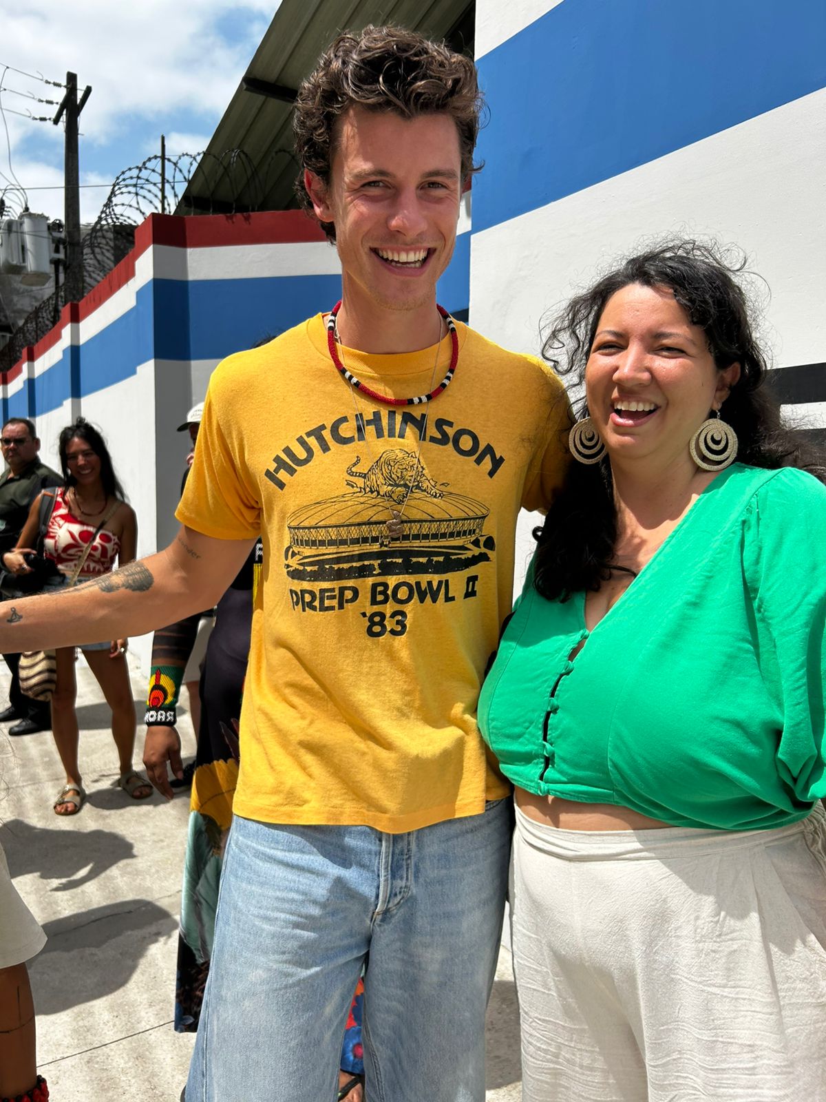 Shawn Mendes visits the Chico Mendes Committee space at COP30 and takes a photo with the environmentalist's granddaughter