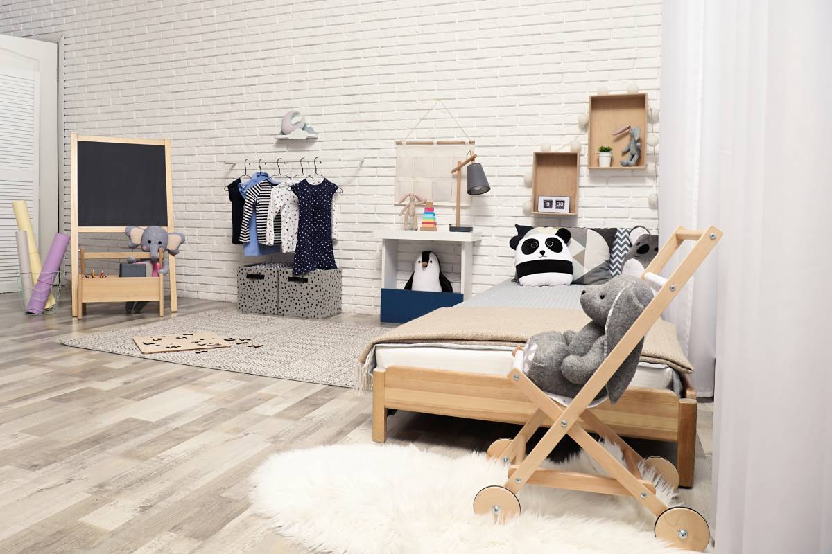 bedroom with low bed, open wardrobe and comfortable shelves