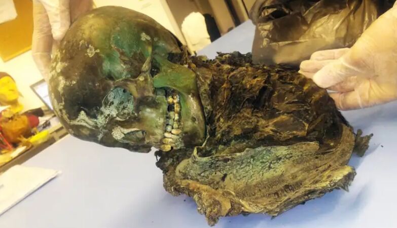 Body of mummified boy turned green inside a copper coffin