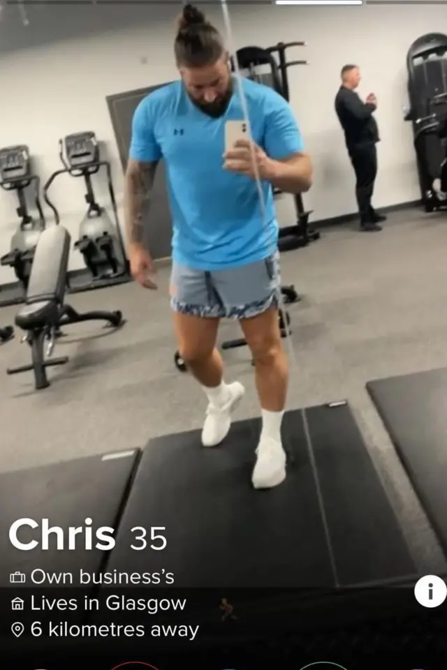 Screenshot of a Tinder profile shows Christopher Harkins on a treadmill at the gym. The photo is a mirror selfie in which he appears holding his cell phone while running, wearing cut-off denim shorts and a light blue t-shirt. He's wearing white socks and sneakers.
