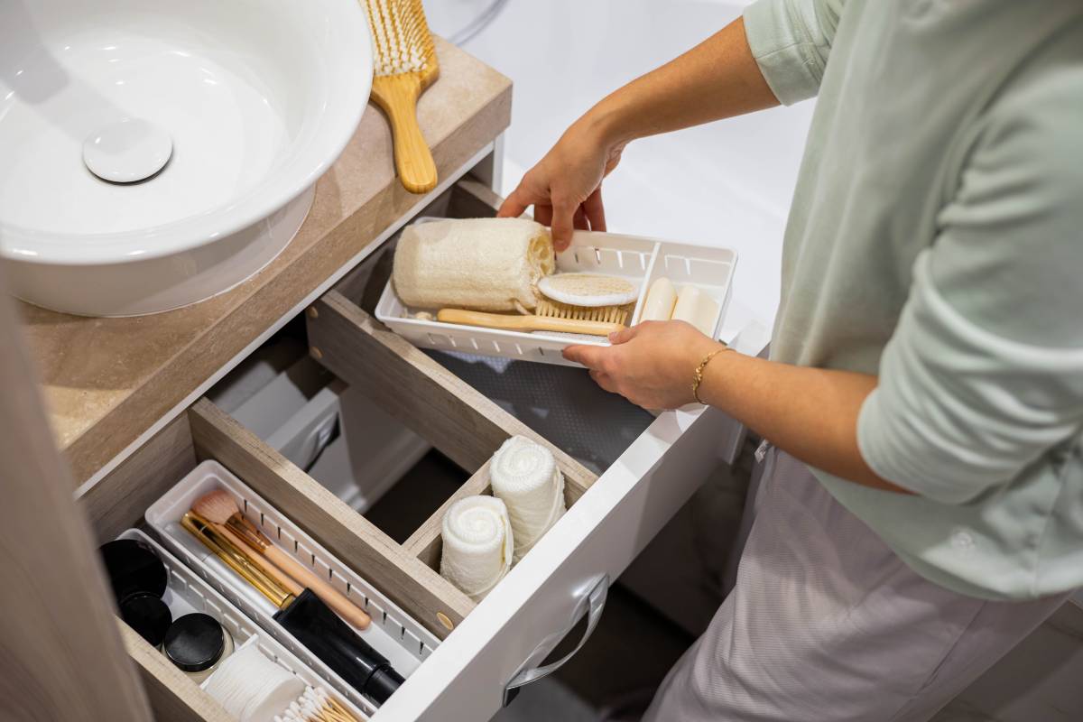 woman tidying up the bathroom drawer