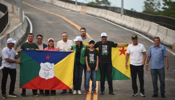 Gladson and Sula cross the Siberian Bridge celebrating a historic milestone for Xapuri
